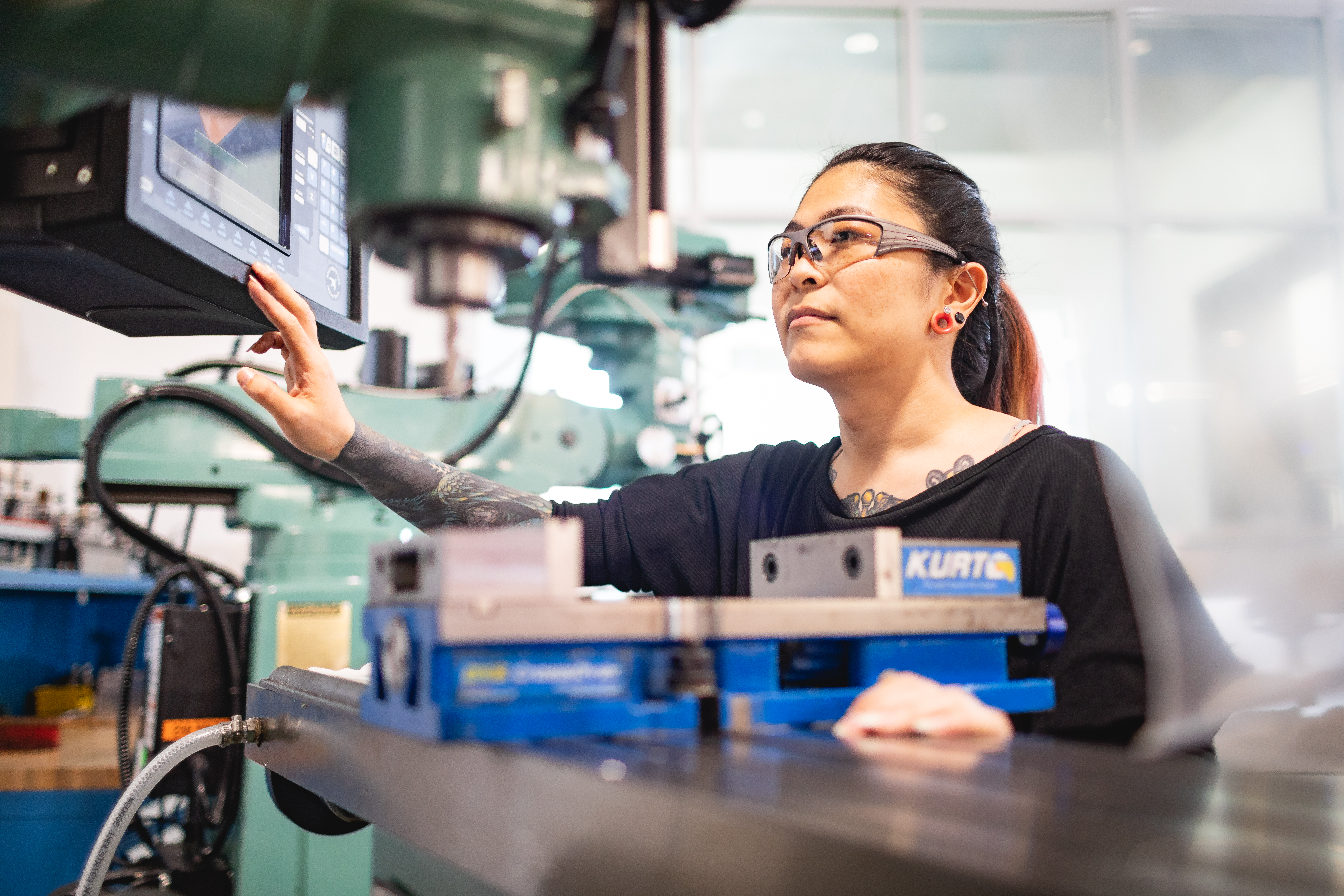 central piedmont student working on mechatronics machine