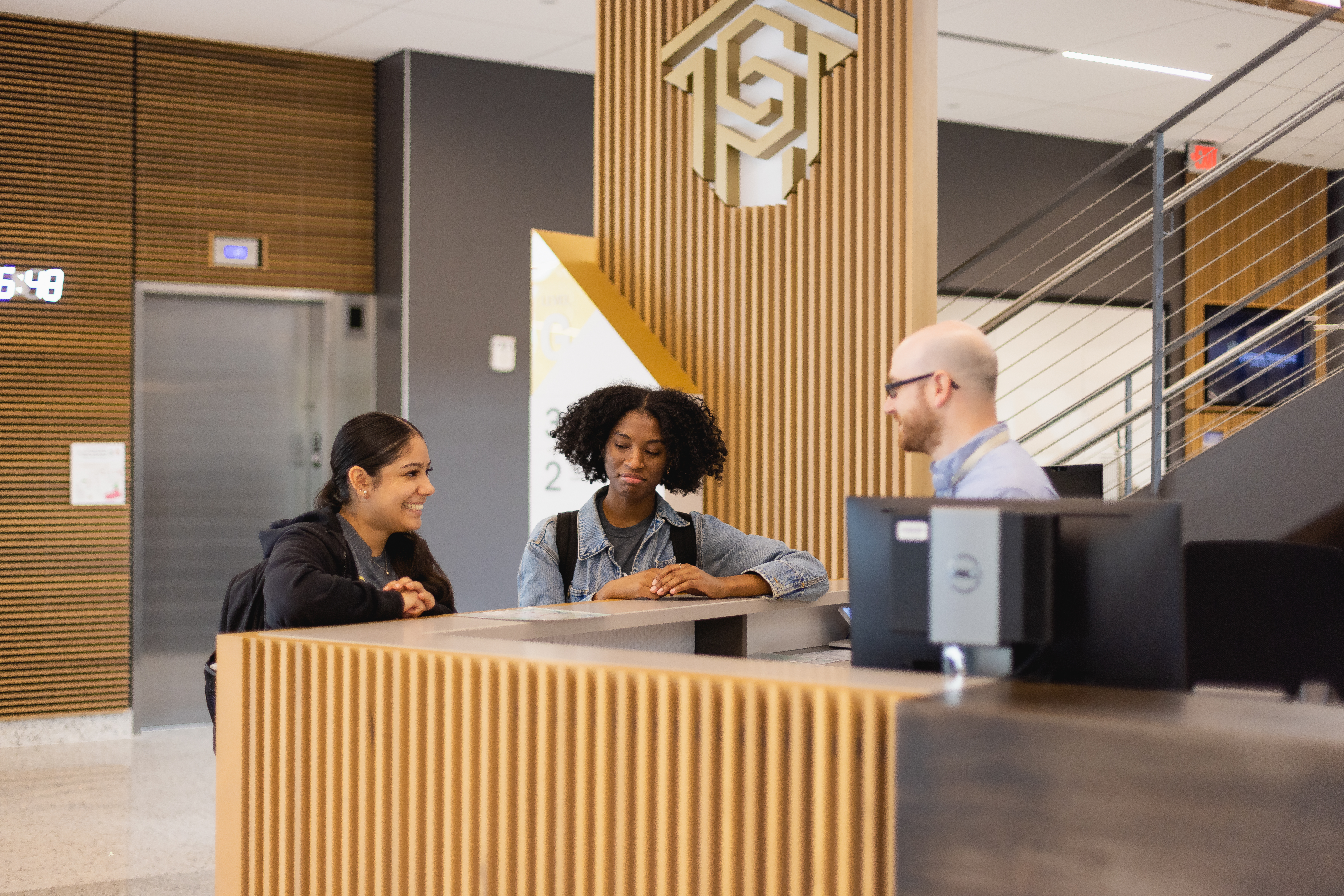 two students at a help desk