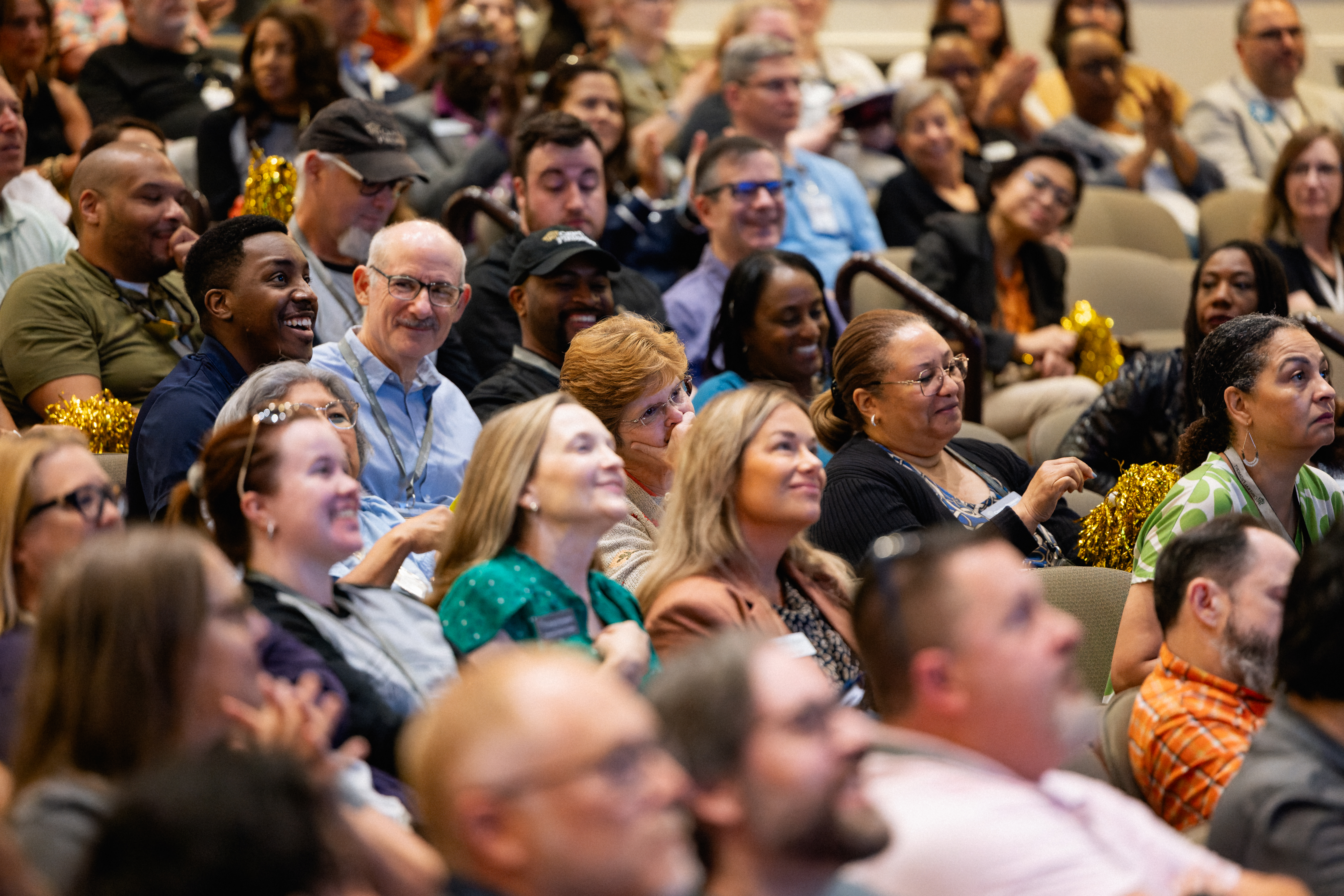 Crowd of staff in theatre seating