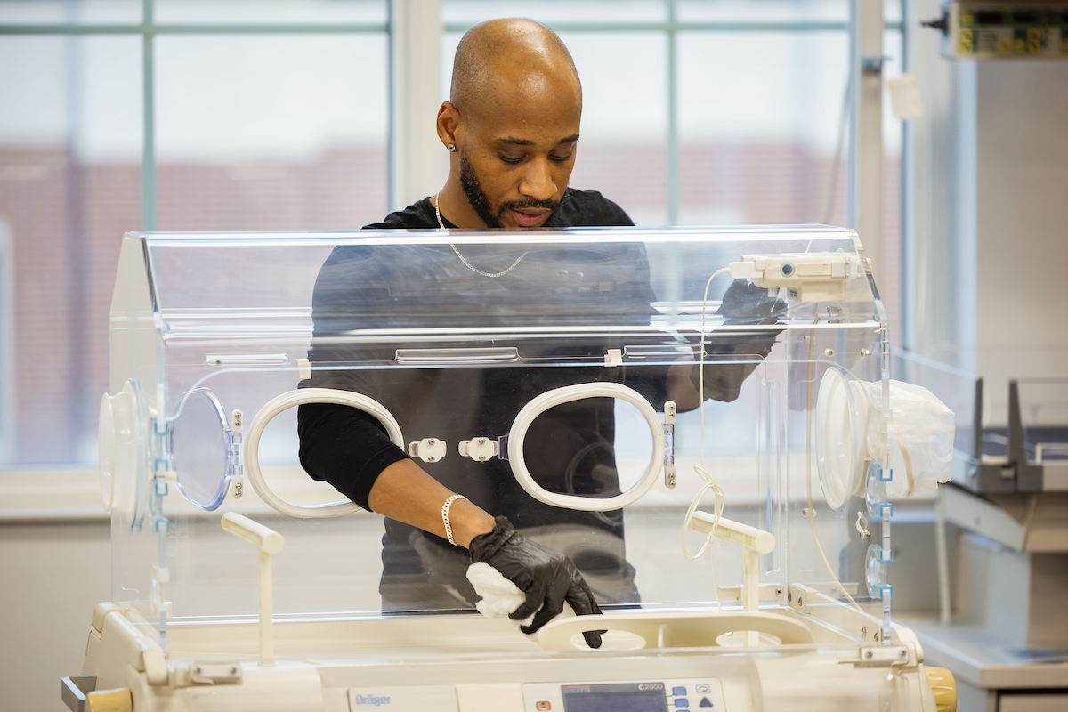 Student exploring medical equipment