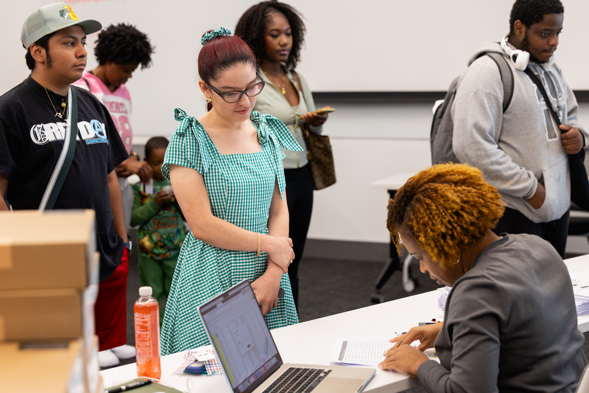 A Central Piedmont student speaking with a staff member
