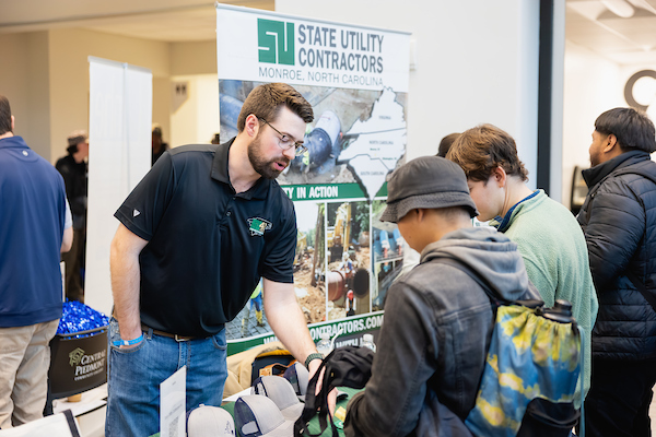 Central Piedmont students visiting an employer's table at a recruitment event