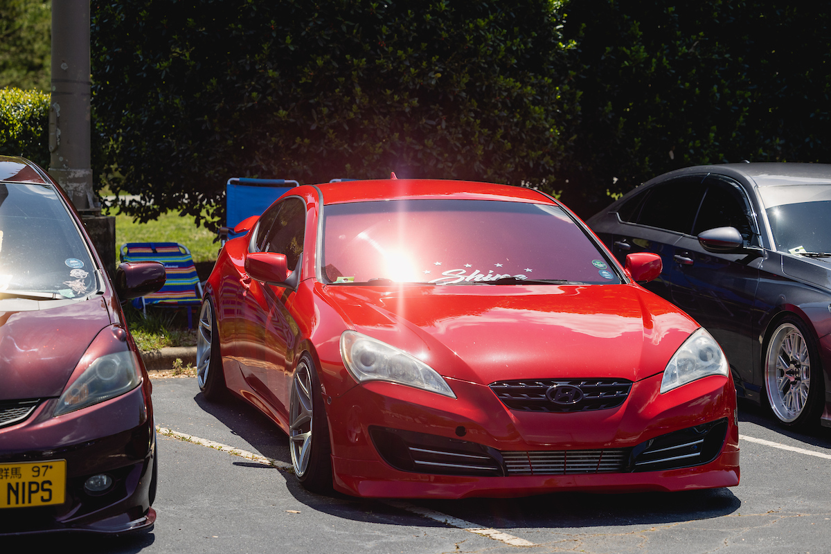 Red car parked crookedly