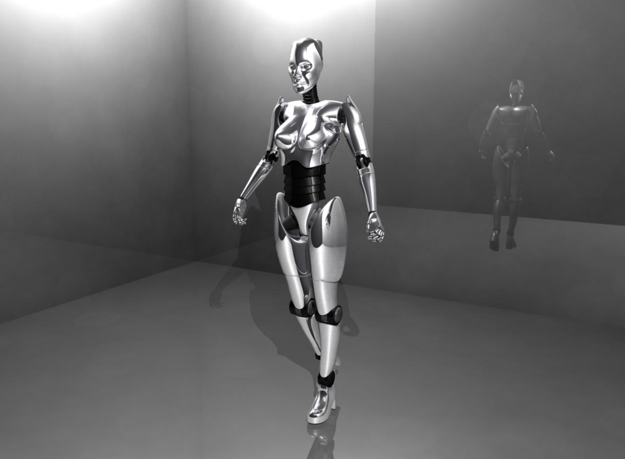 Metallic humanoid robot standing in an empty grey room with a mirrored wall