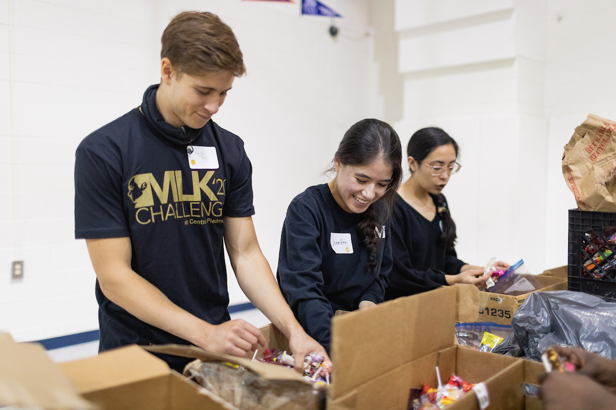 Students unpacking boxes of food