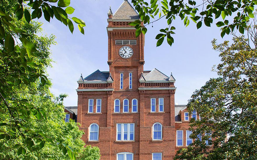 Clock tower of a historic brick building at Johnson C. Smith University
