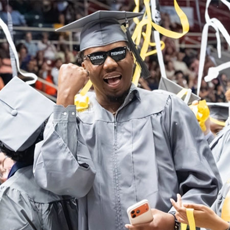 A Central Piedmont student celebrating at graduation in May 2026