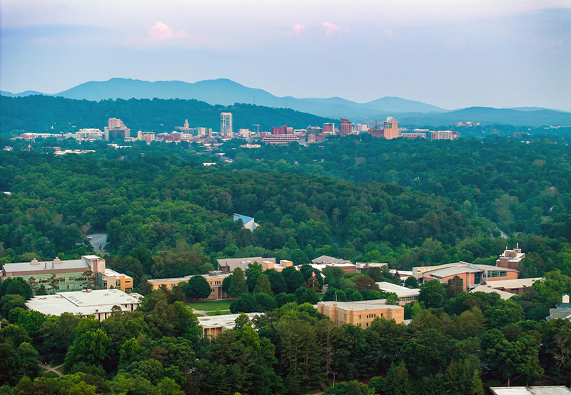 View over the UNC Asheville campus with the Blue Ridge Mountains beyond
