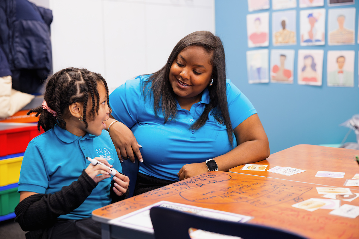 Student with teacher in training