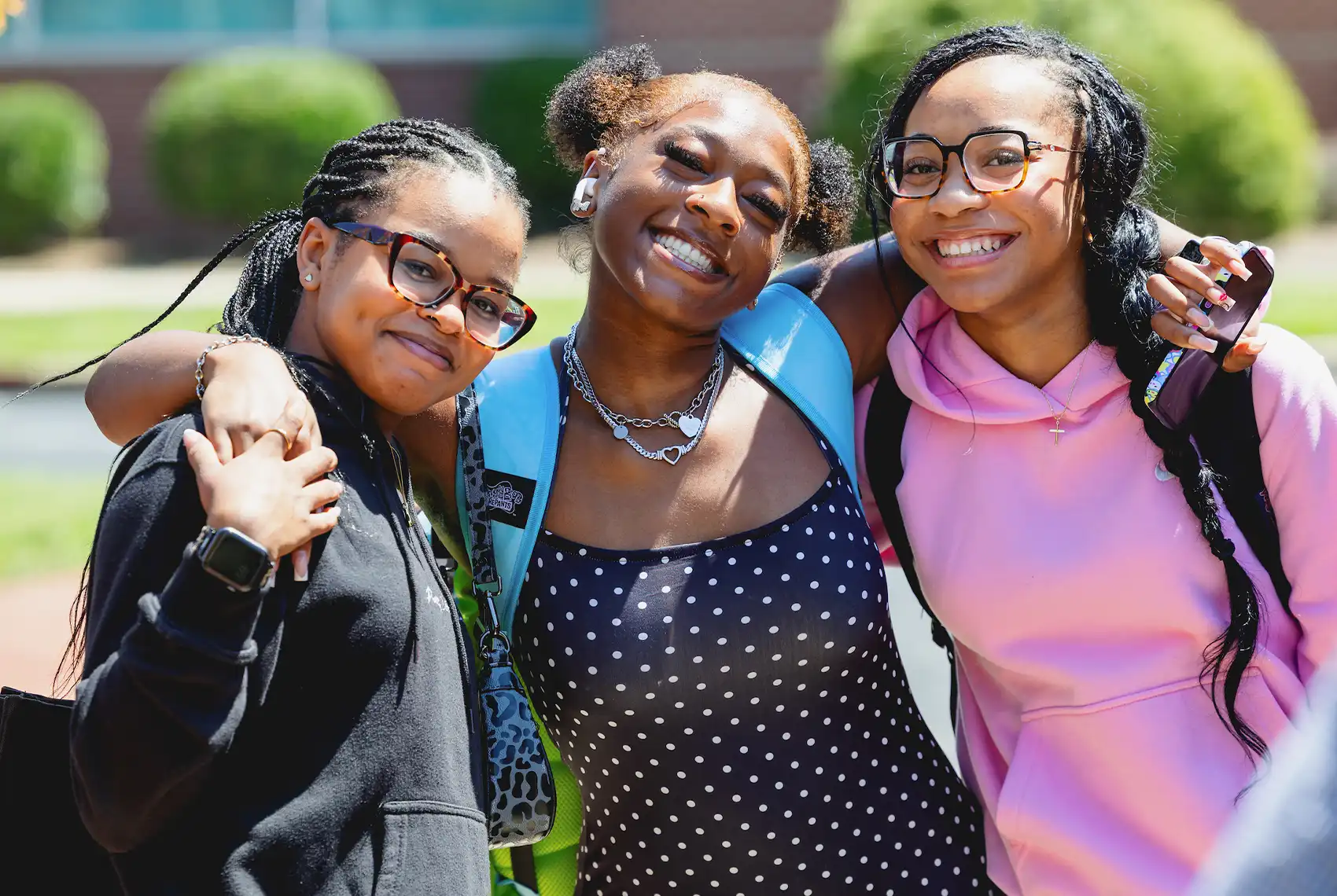 Three happy, smiling Central Piedmont students at Levine Campus