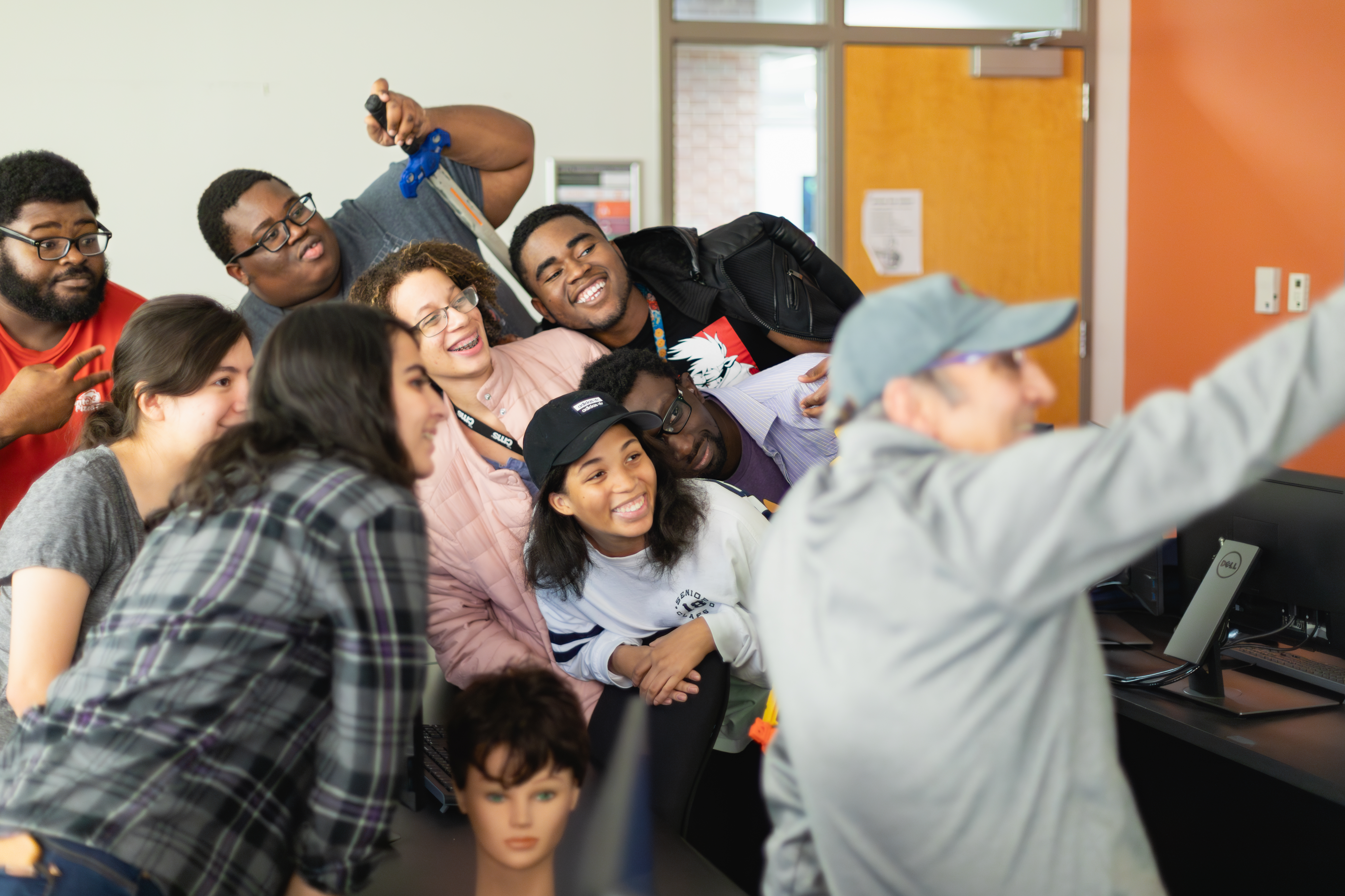 Group of students huddled together for a selfie
