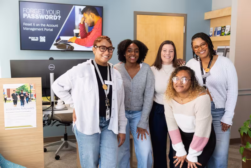 Staff of the wellness center posing in the front lobby