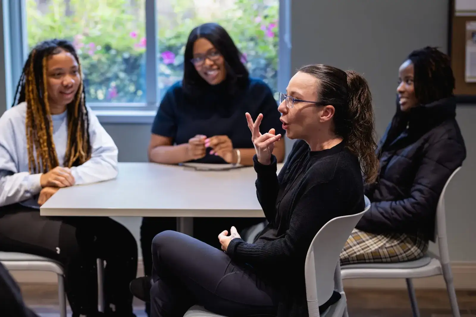 Students practising sign language interpreting in a seminar room