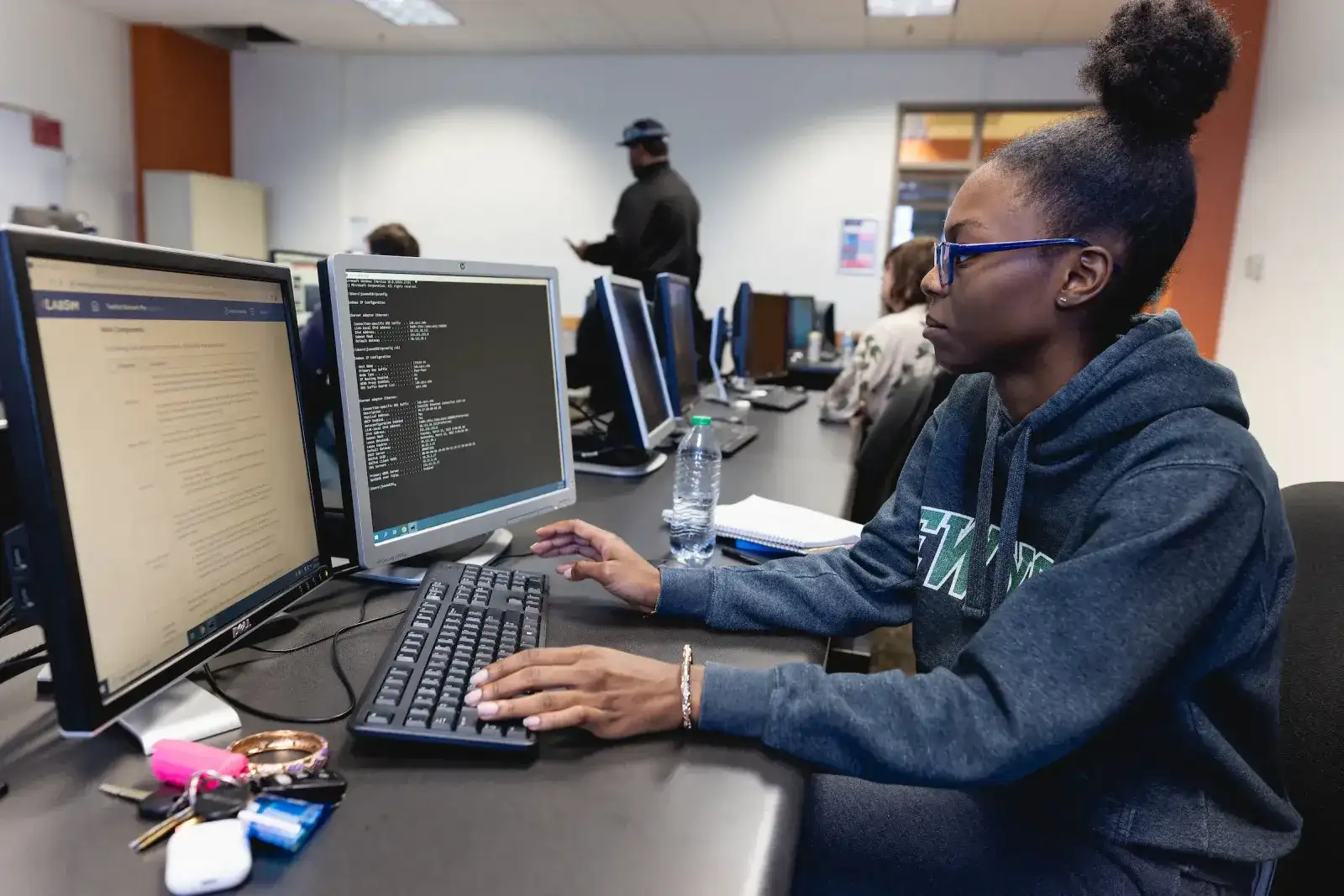 Student working at a computer in an open computer lab