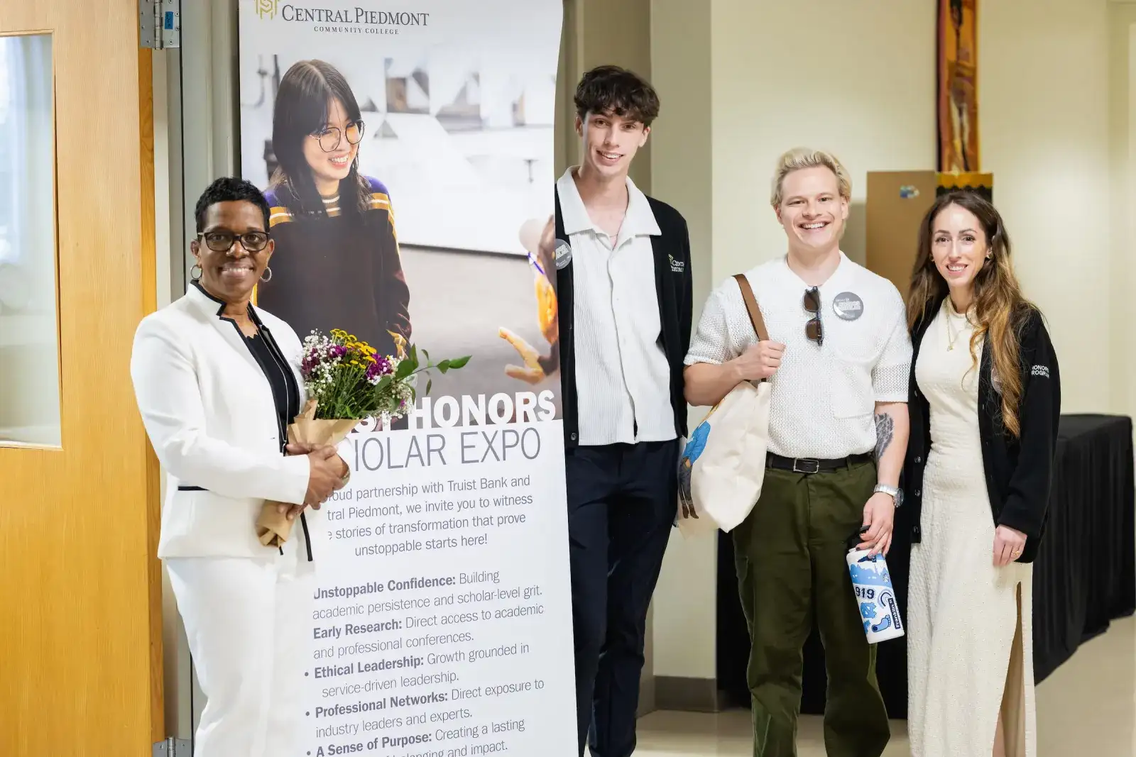 Honors program students with a faculty member at the Honors Scholar Expo
