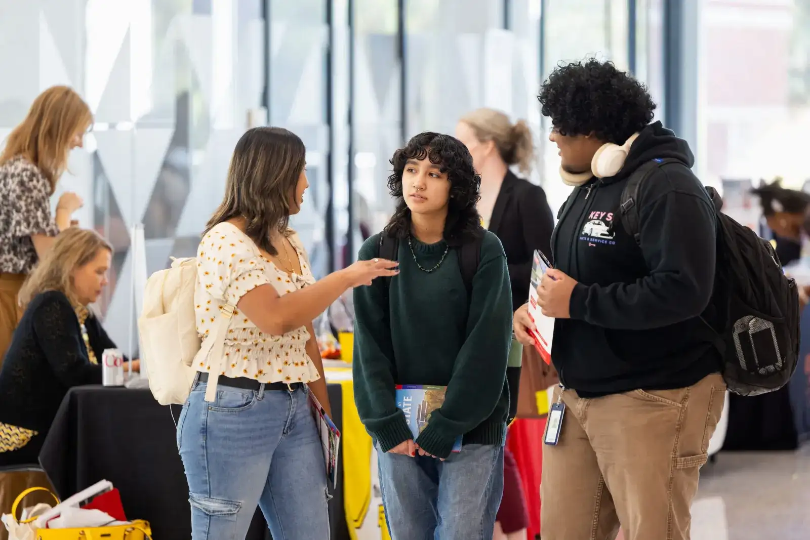 Students talking with one another at a campus transfer fair