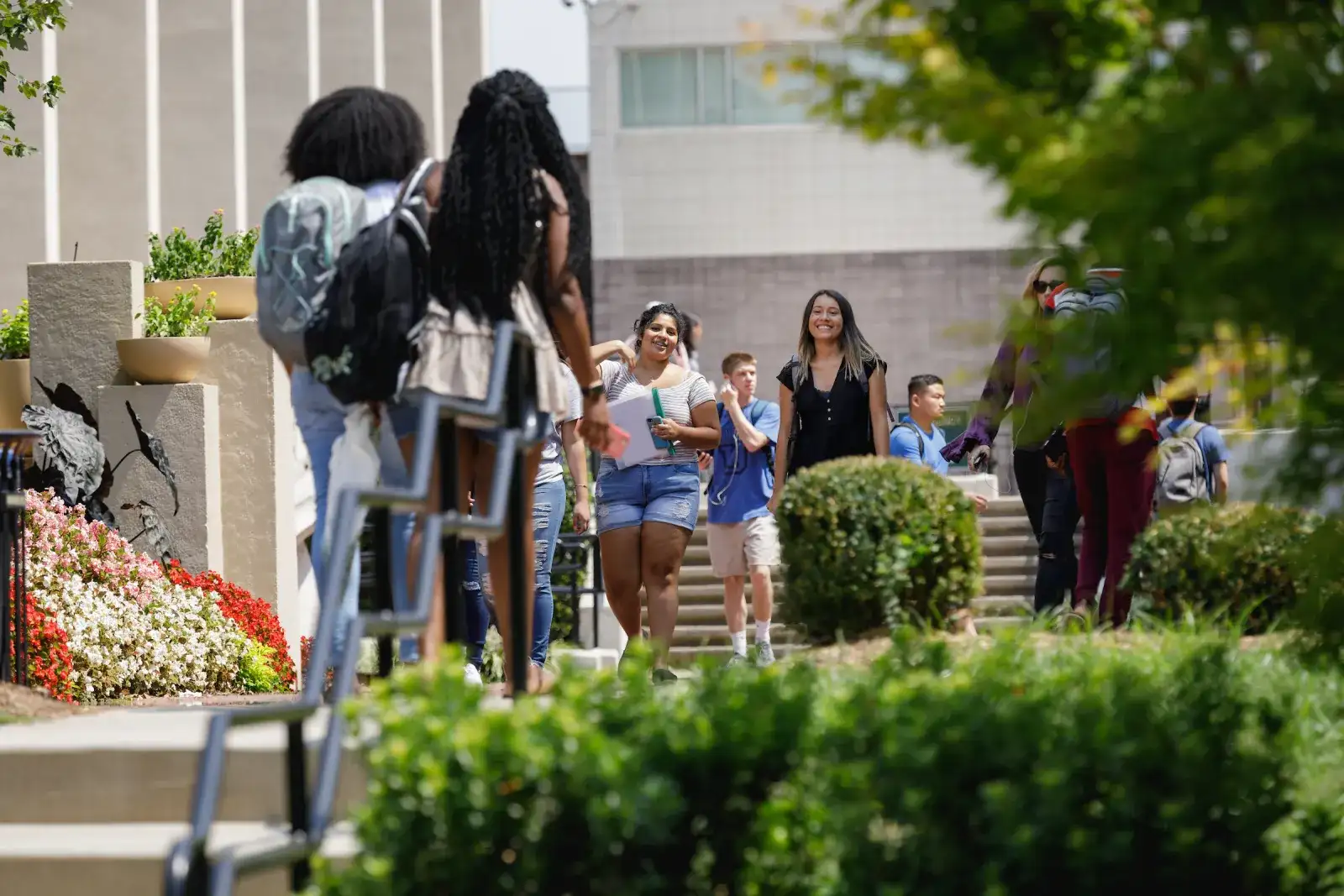 Students walking outside on Central Piedmont’s campus tour during beautiful day.