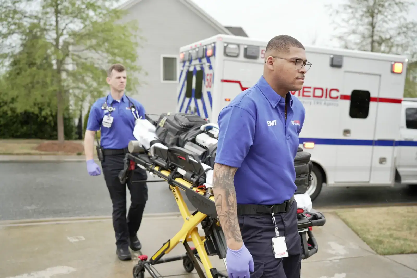 EMS students pulling a stretcher