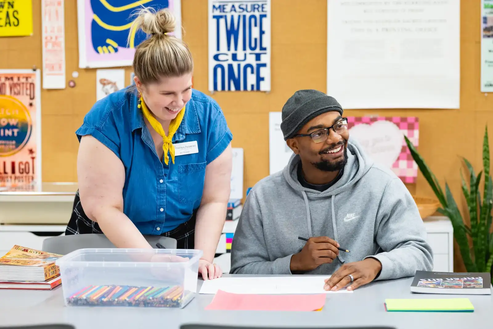 graphic arts student working with an instructor