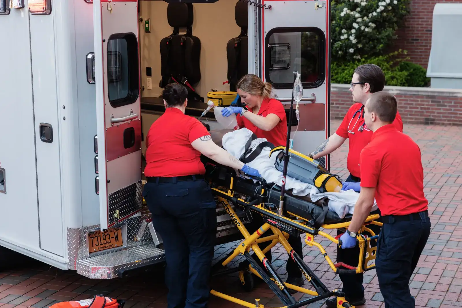 Students behind an ambulance