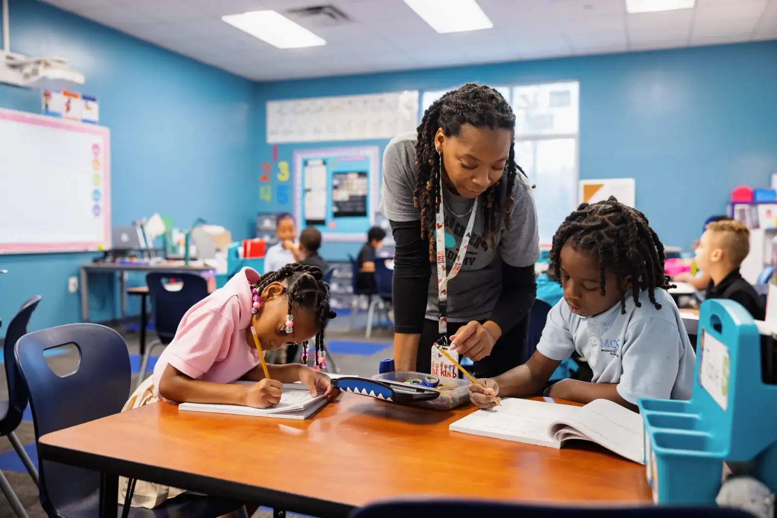 Central Piedmont teaching program graduate in an elementary classroom working with students