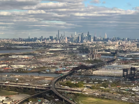 Aerial view of a city skyline and interstate interchange