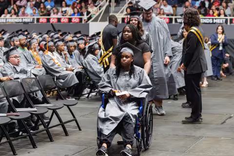 A Central Piedmont student in a wheelchair at graduation