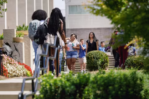Students walking outside on Central Piedmont’s campus tour during beautiful day.