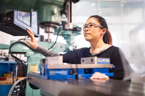 central piedmont student working on mechatronics machine