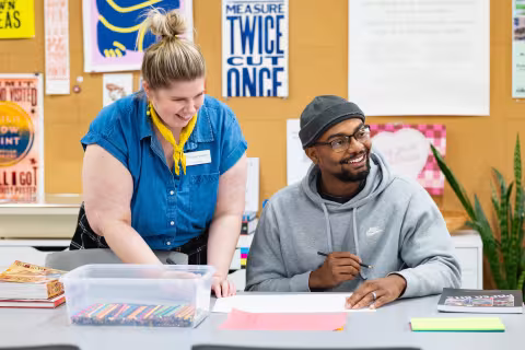 graphic arts student working with an instructor
