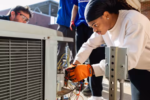 central piedmont student working on HVAC 