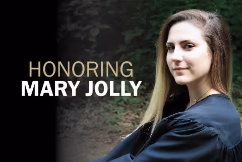 Mary Jolly sitting and looking at camera